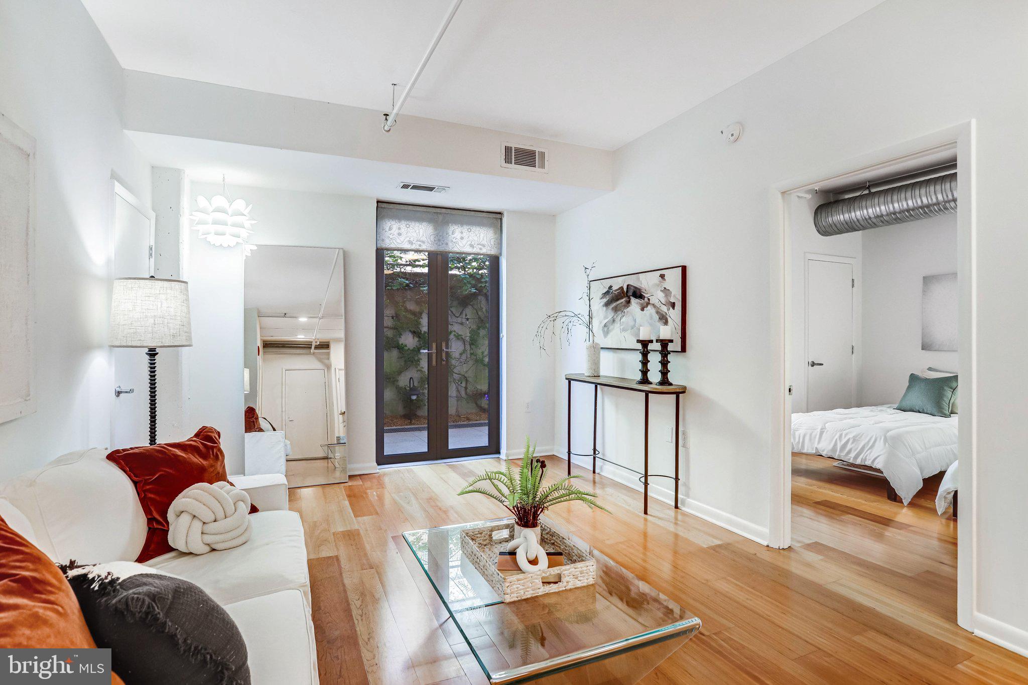 1300 N Street Northwest, Unit 15 Washington, DC 20005 - Photo 29 of 51 a living room with furniture and a table