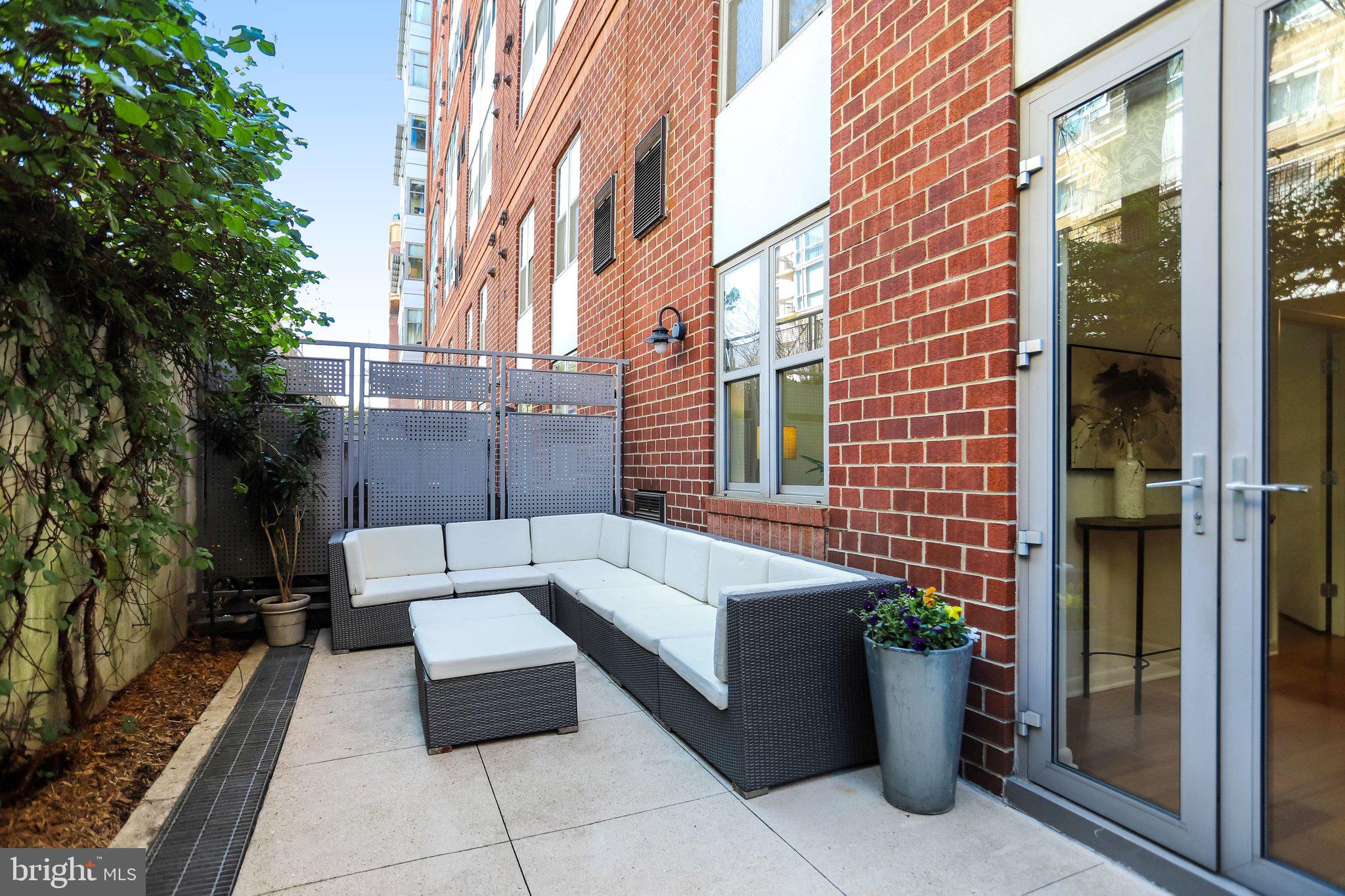 1300 N Street Northwest, Unit 15 Washington, DC 20005 - Photo 35 of 51 a view of a patio with couches and potted plants