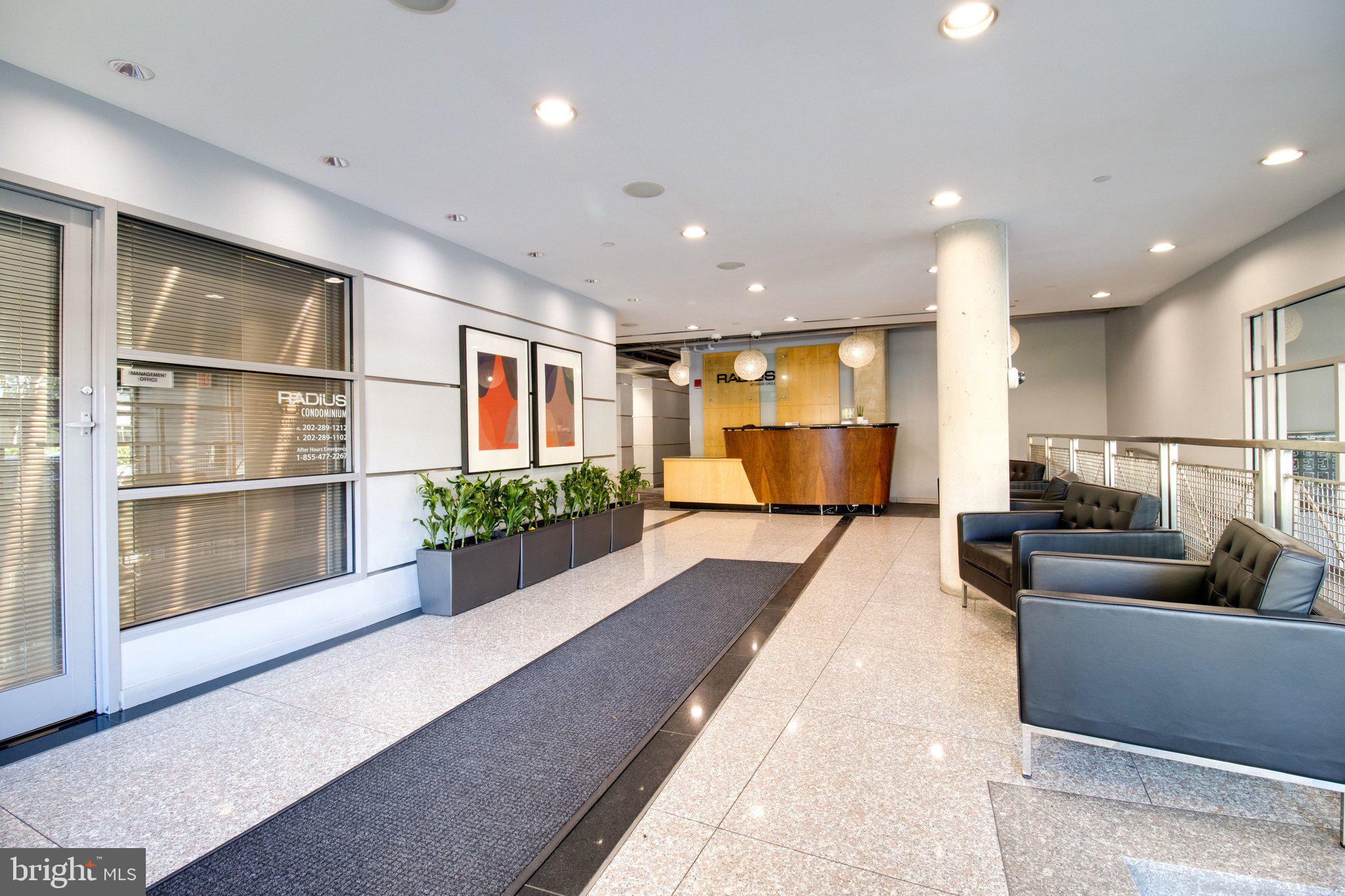1300 N Street Northwest, Unit 15 Washington, DC 20005 - Photo 44 of 51 a living room with furniture and a large window