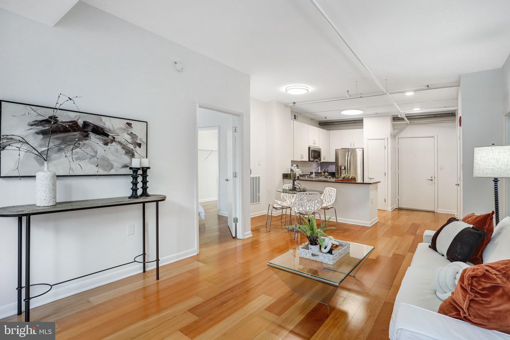 1300 N Street Northwest, Unit 15 Washington, DC 20005 - Photo 6 of 51 a living room with furniture and kitchen view
