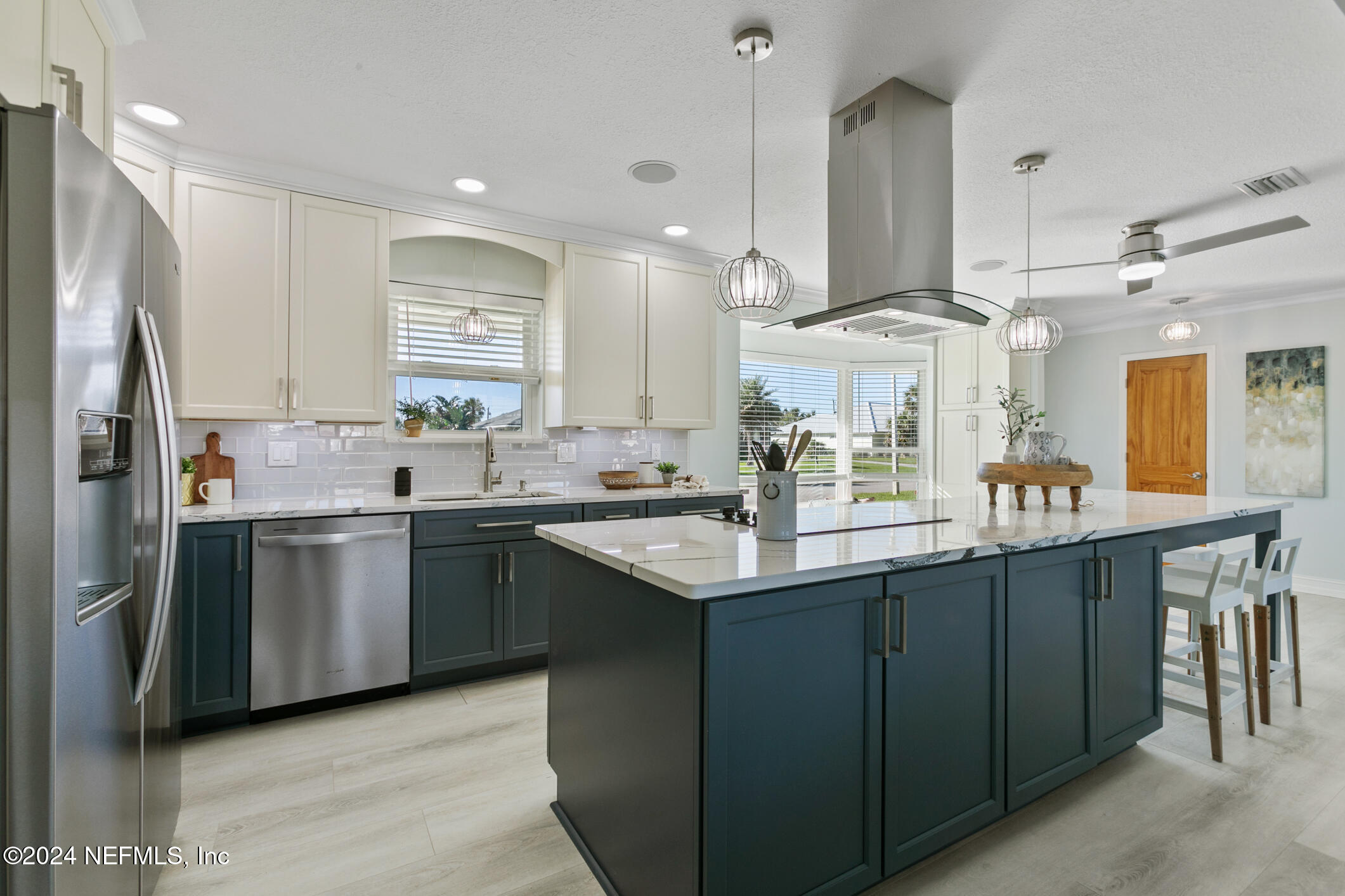 47 Sandpiper Drive St. Augustine, FL 32080 - Photo 12 of 61 a kitchen with stainless steel appliances granite countertop a sink a stove a refrigerator and island with wooden floor