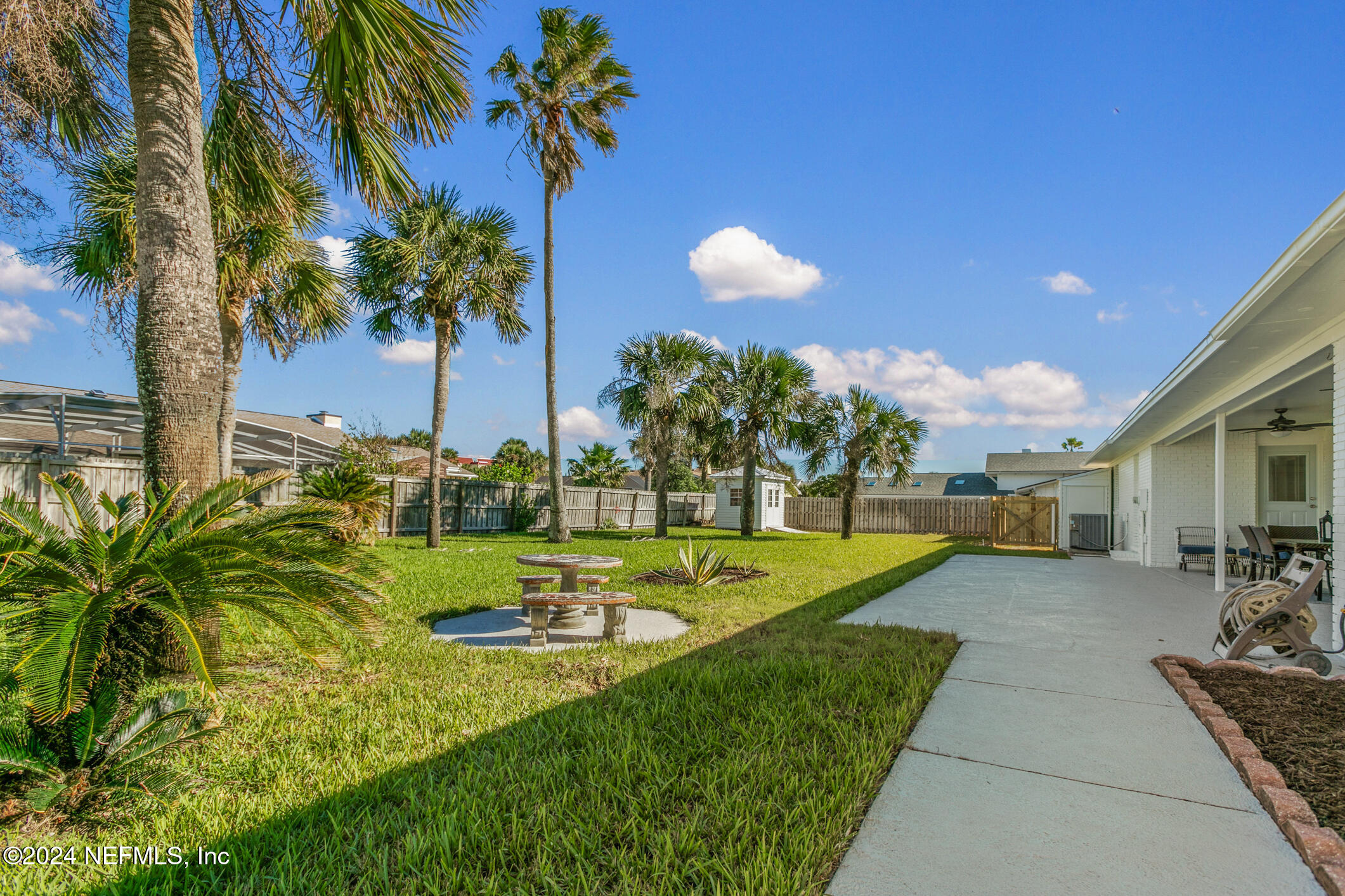 47 Sandpiper Drive St. Augustine, FL 32080 - Photo 24 of 61 a view of a house with swimming pool and a yard