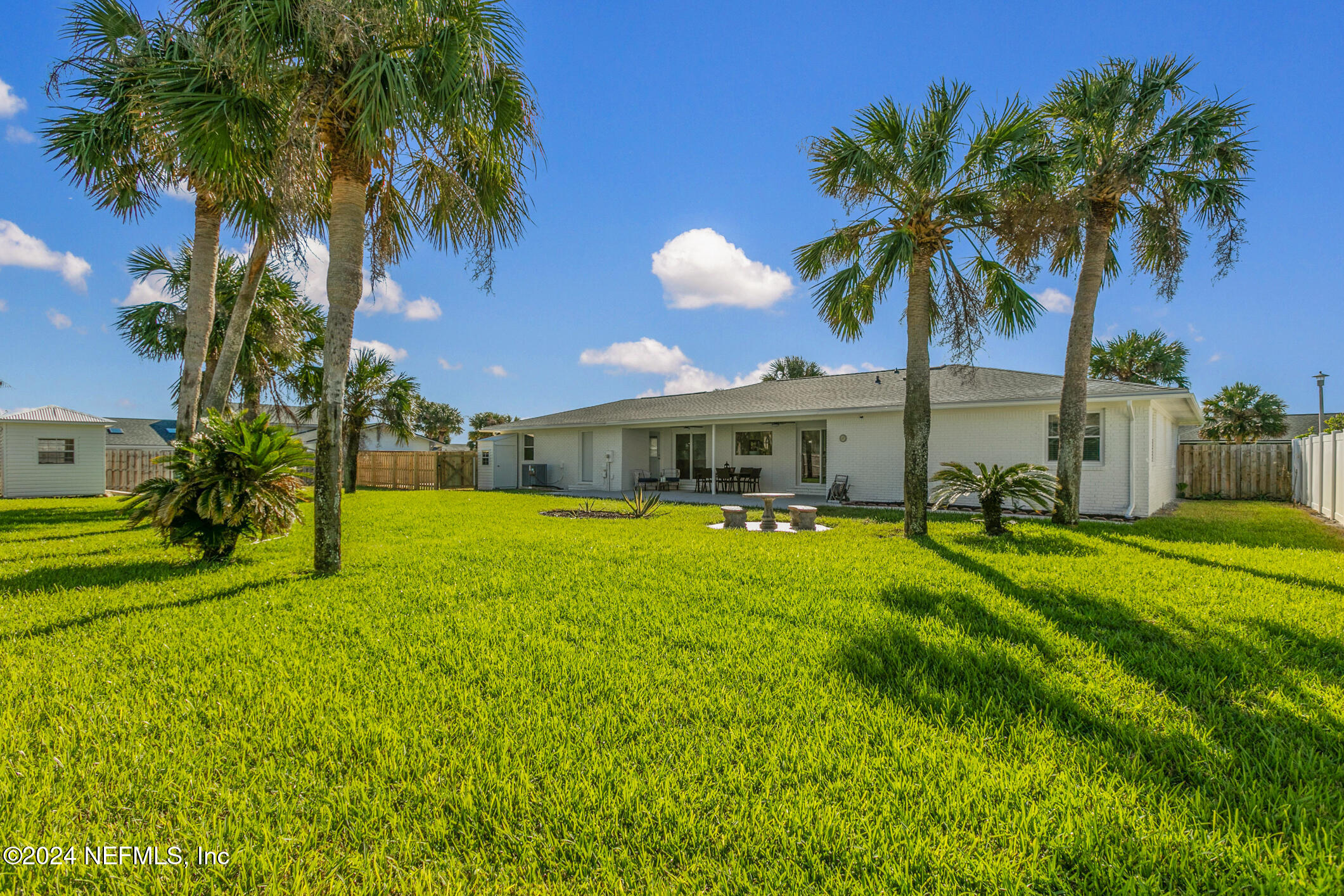 47 Sandpiper Drive St. Augustine, FL 32080 - Photo 25 of 61 a front view of house with yard and swimming pool