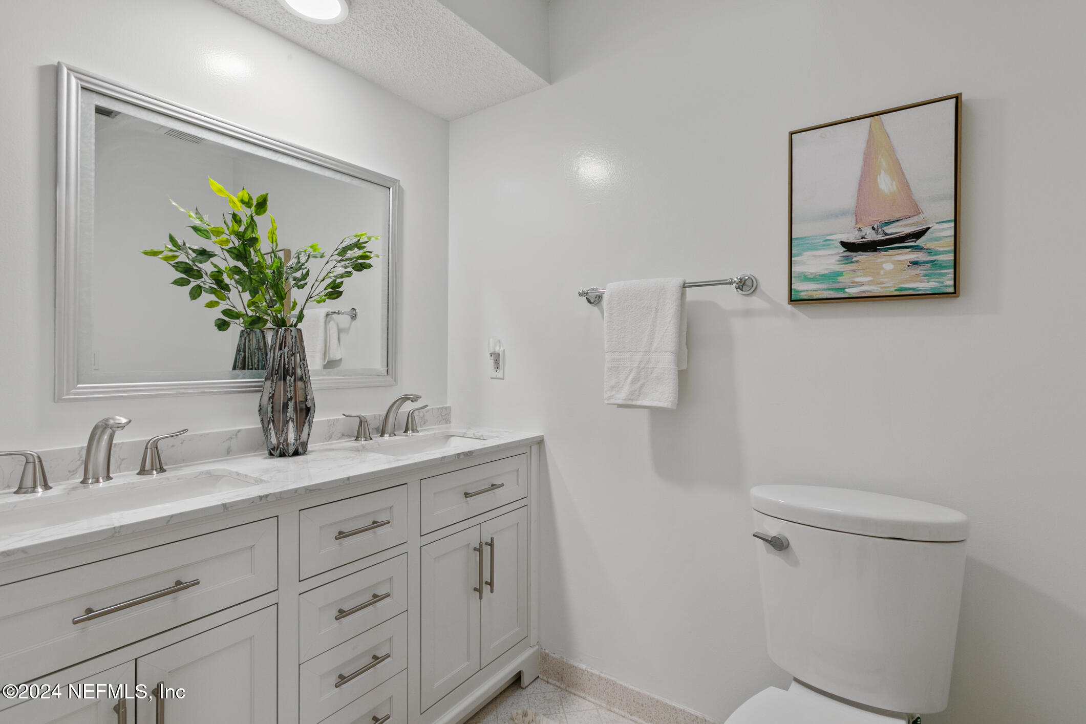 47 Sandpiper Drive St. Augustine, FL 32080 - Photo 33 of 61 a bathroom with a toilet sink and mirror