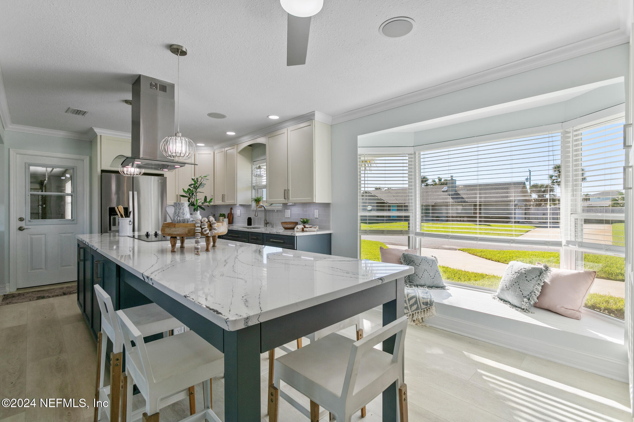 47 Sandpiper Drive St. Augustine, FL 32080 - Photo 10 of 61 a dining hall with stainless steel appliances kitchen island granite countertop furniture and a large window