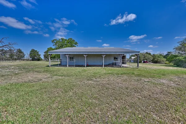 a open kitchen with stainless steel appliances granite countertop a sink a stove and a wooden floors