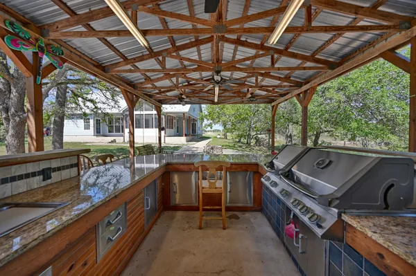 a kitchen with a sink stove and refrigerator