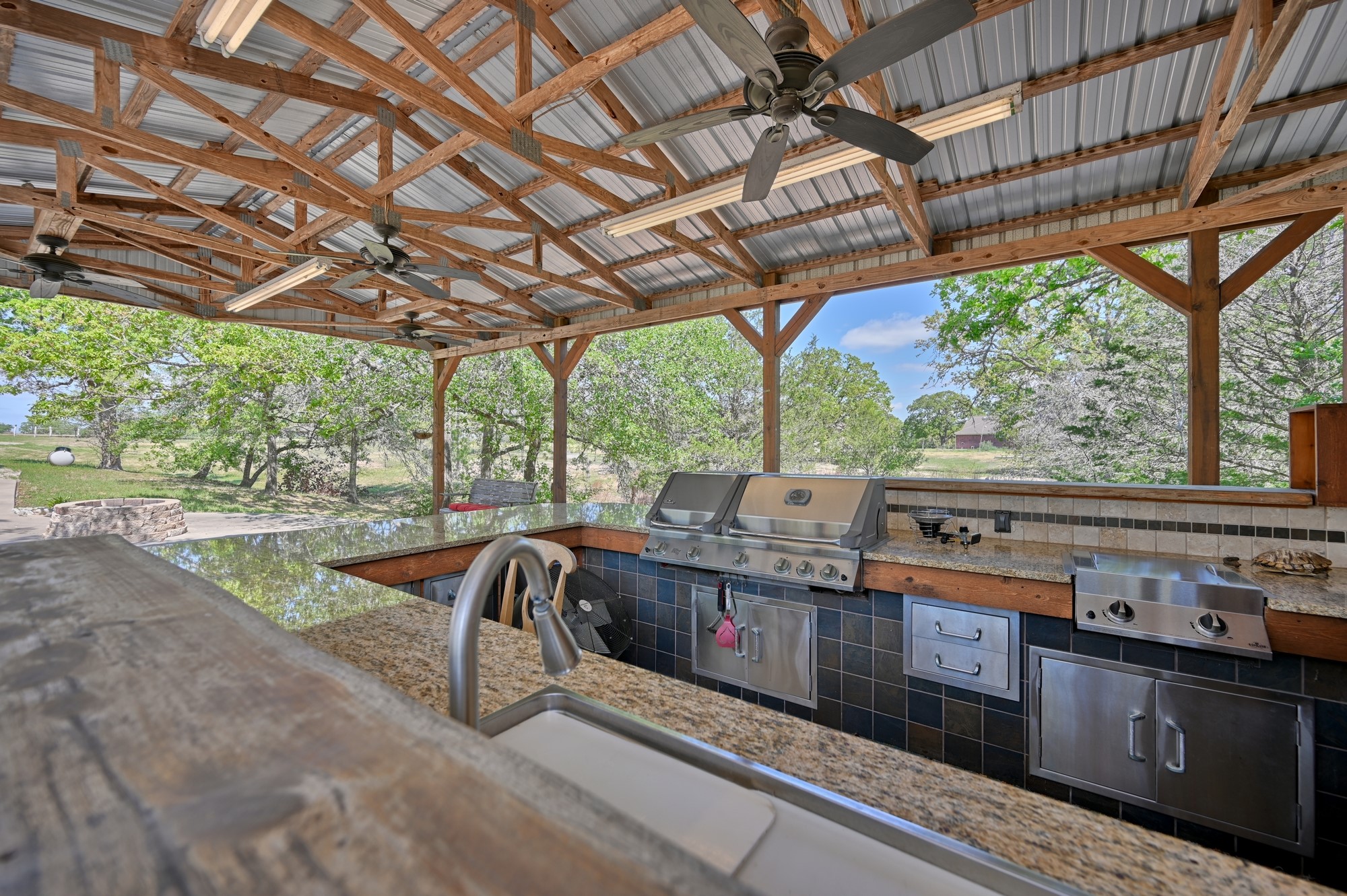 350 Owl Creek Road Giddings, TX 78942 - Photo 21 of 29 a view of a patio with a table and chairs