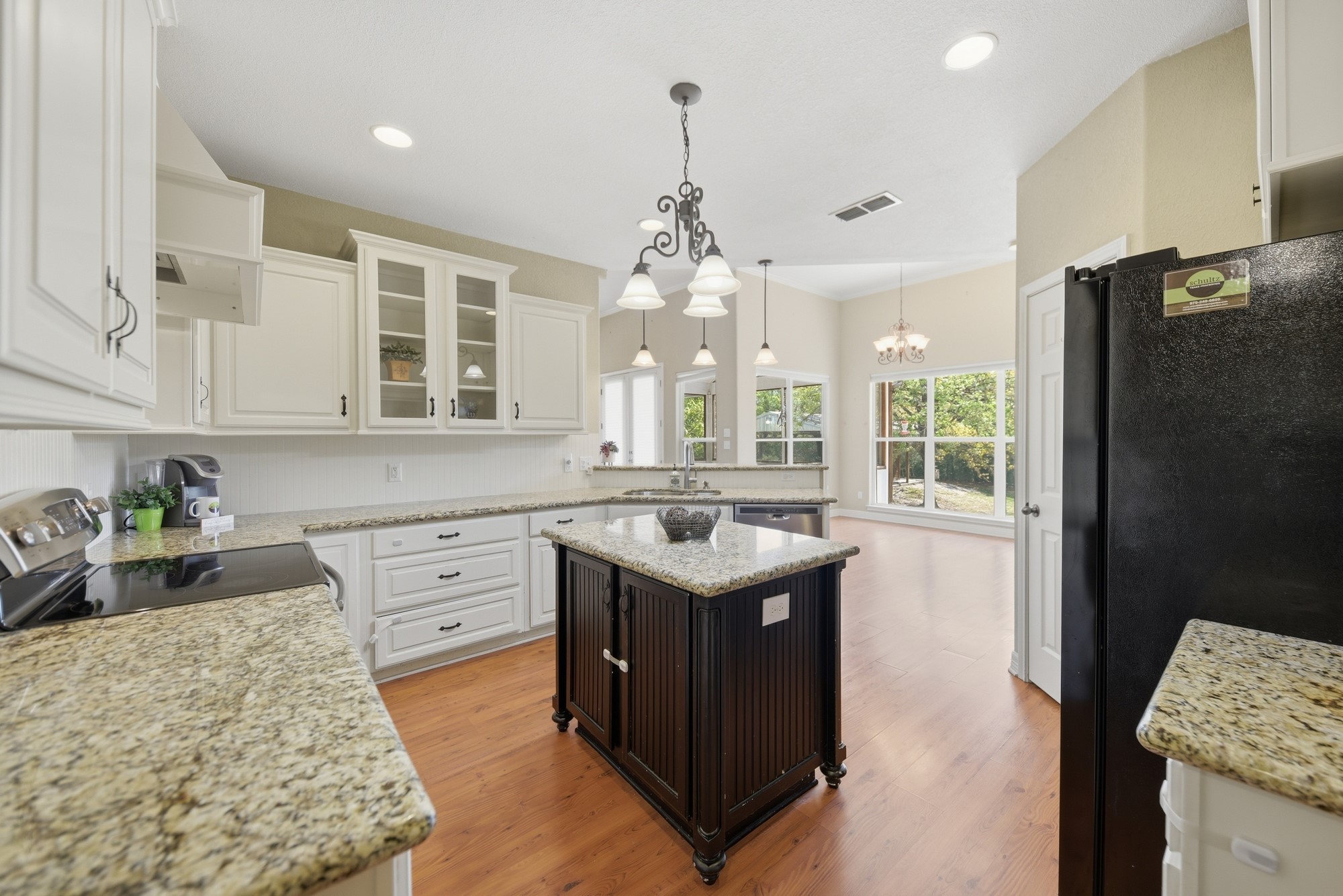 350 Owl Creek Road Giddings, TX 78942 - Photo 23 of 29 a kitchen with a sink stove and refrigerator