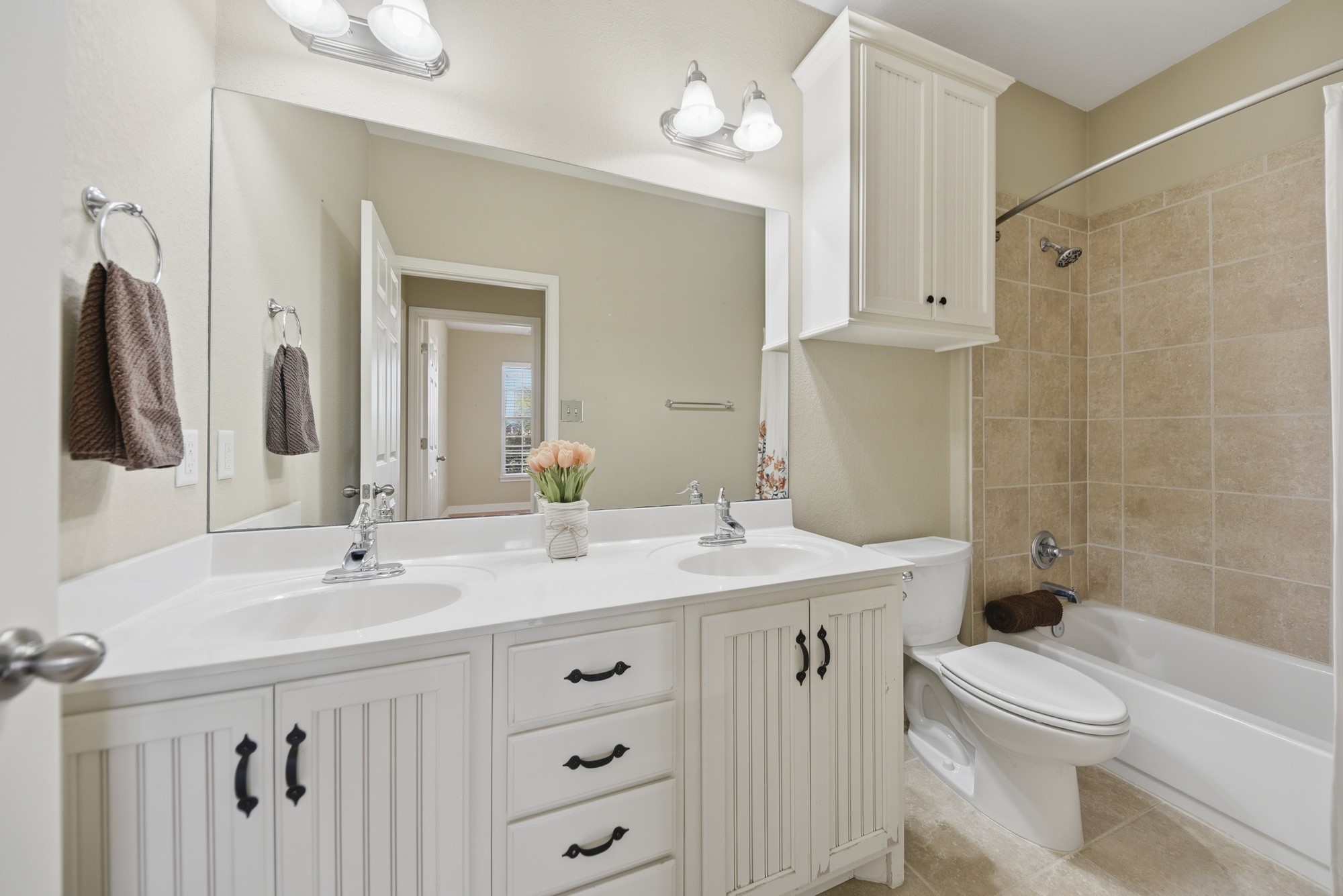 350 Owl Creek Road Giddings, TX 78942 - Photo 26 of 29 a bathroom with a sink a toilet and a mirror