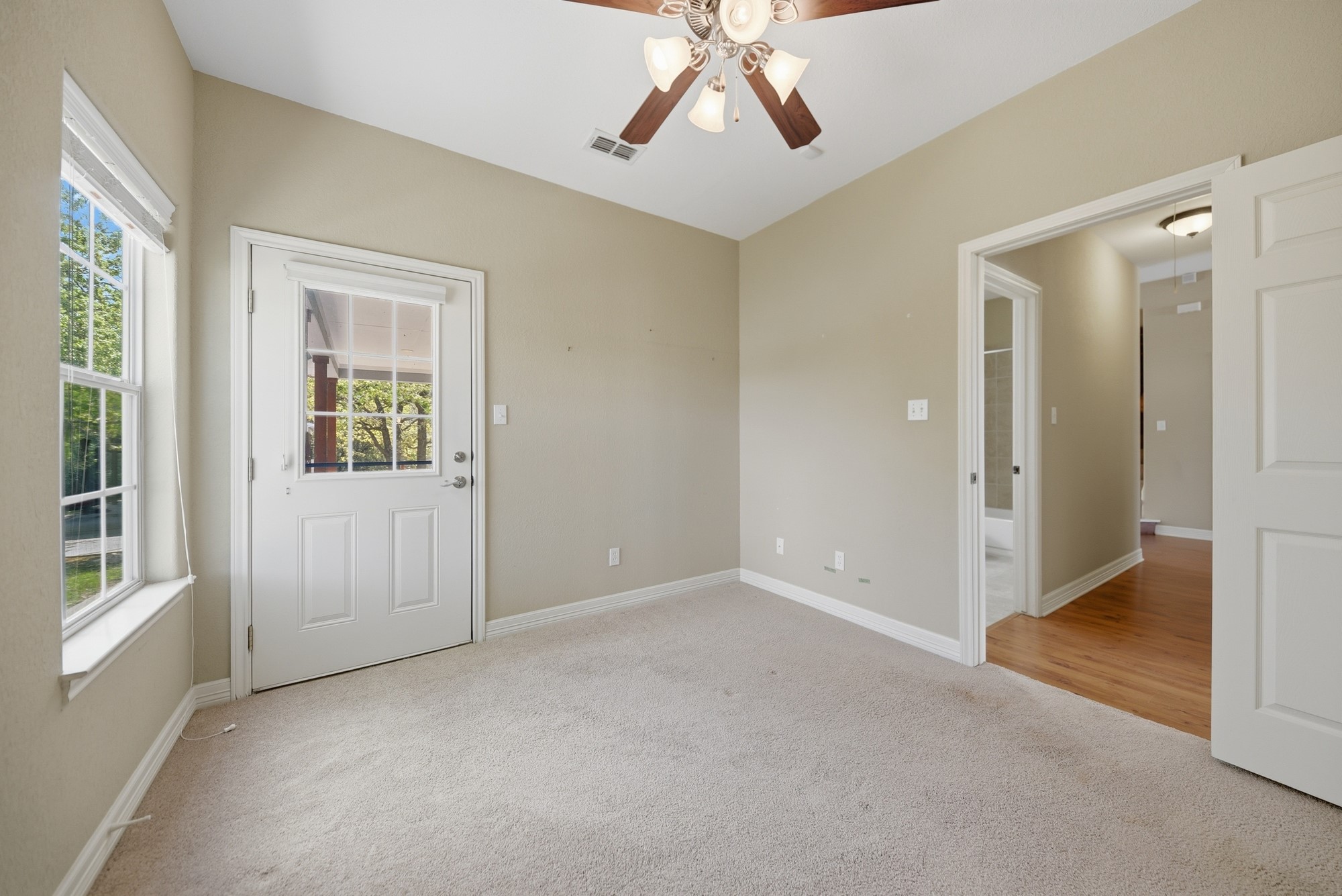 350 Owl Creek Road Giddings, TX 78942 - Photo 29 of 29 an empty room with windows and entrance