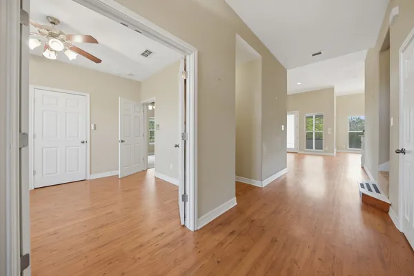 a view of an empty room with windows