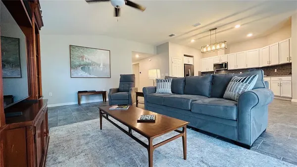 a living room with furniture and a window