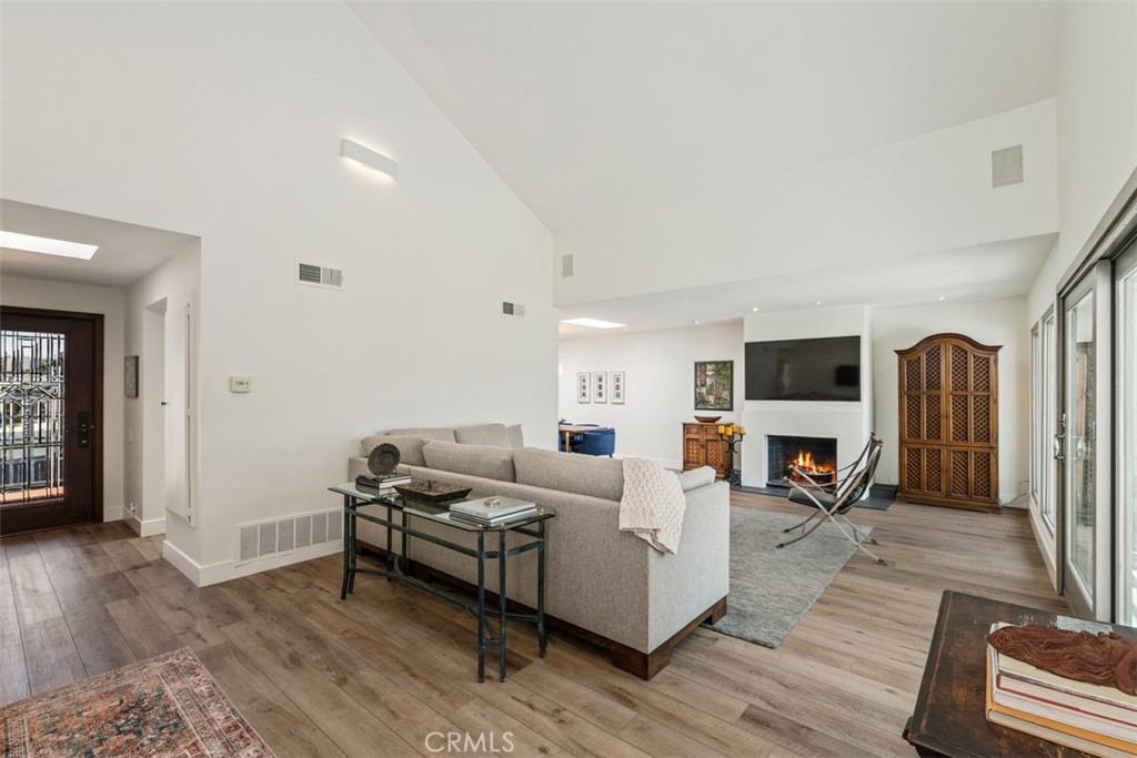 23862 Marmara Bay Dana Point, CA 92629 - Photo 7 of 21 a living room with furniture flat screen tv and a fireplace