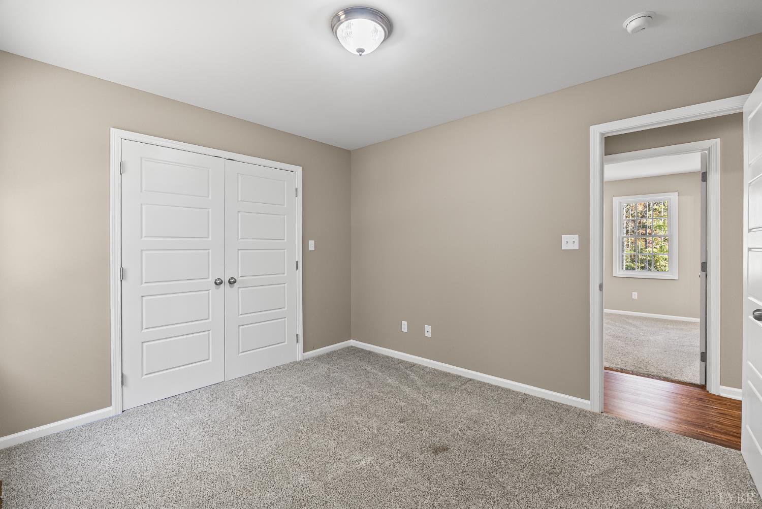 761 Chapel Grove Road Evington, VA 24550 - Photo 15 of 39 an empty room with closet and mirror
