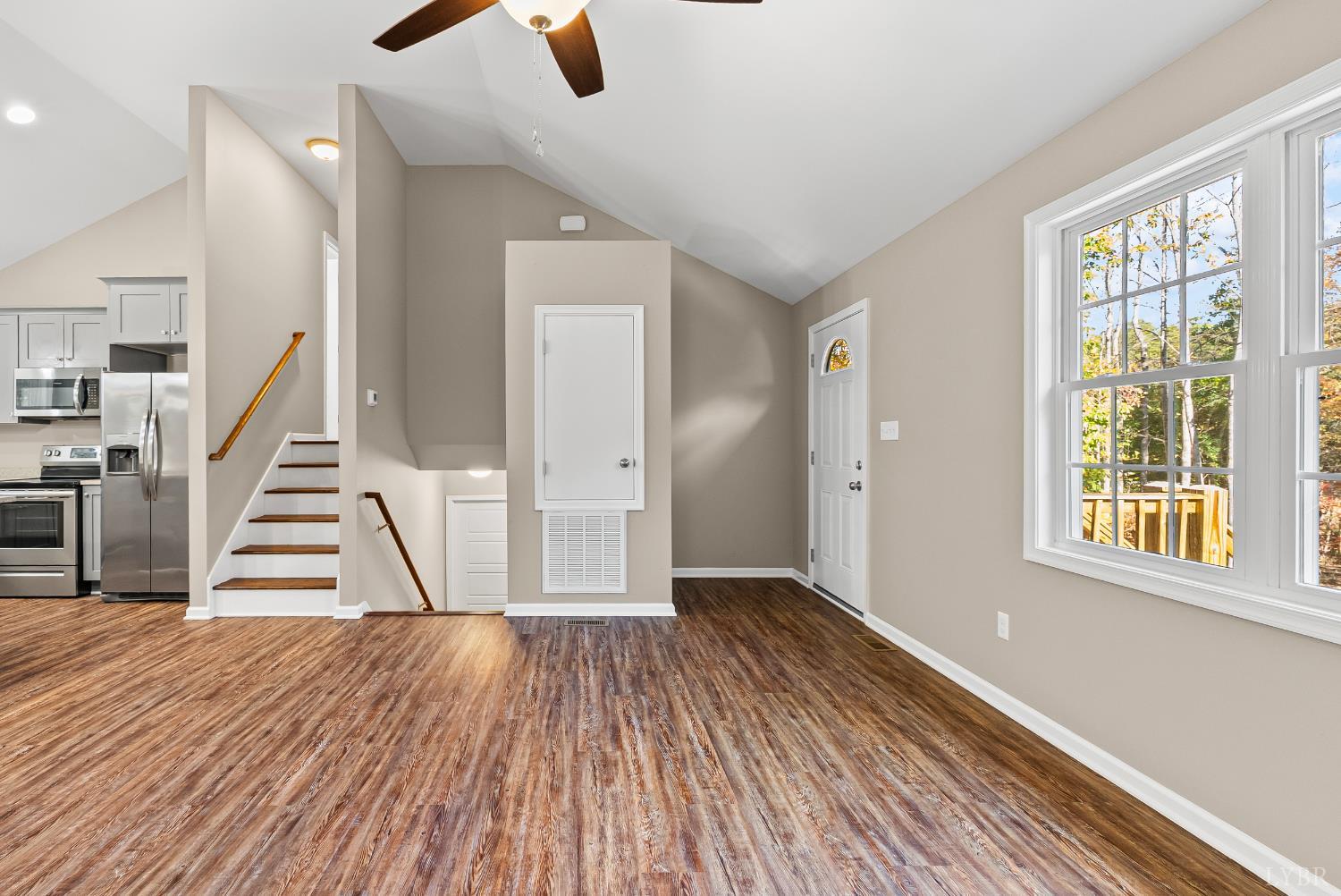 761 Chapel Grove Road Evington, VA 24550 - Photo 5 of 39 a view of empty room with wooden floor and window