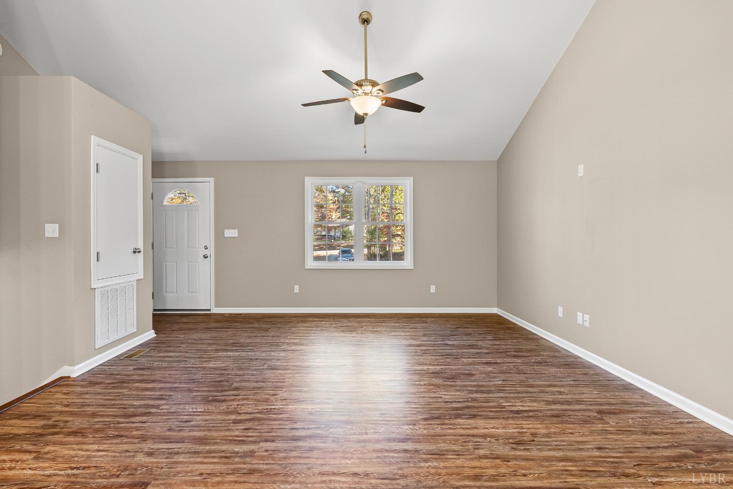 761 Chapel Grove Road Evington, VA 24550 - Photo 6 of 39 wooden floor in an empty room with a window