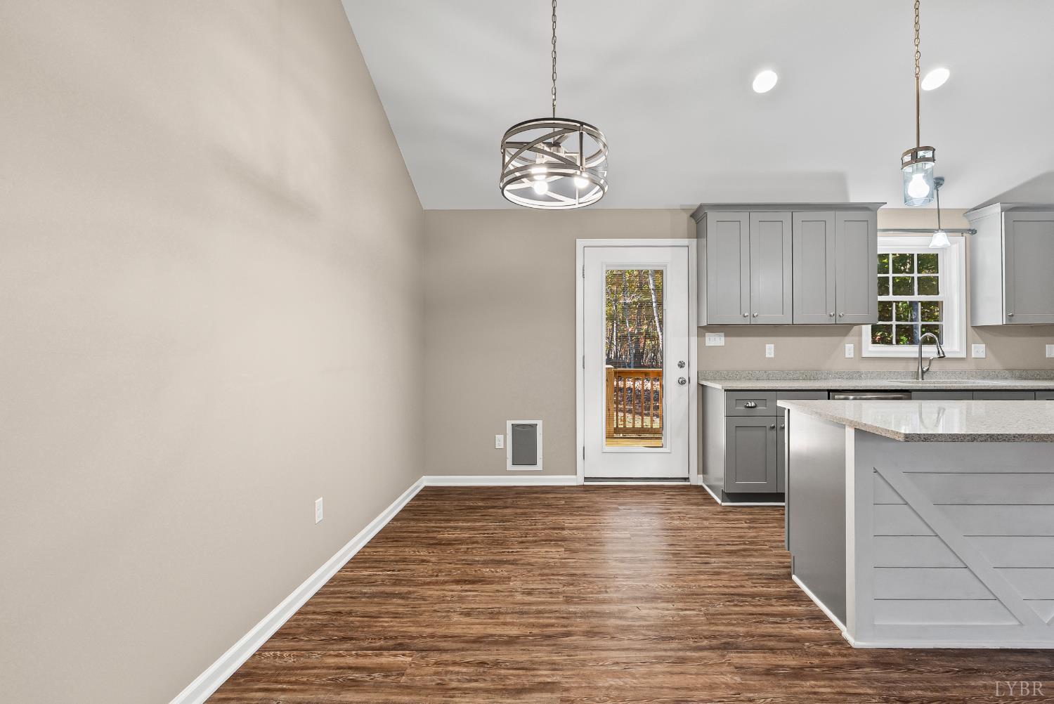 761 Chapel Grove Road Evington, VA 24550 - Photo 7 of 39 a very nice looking kitchen with granite countertop a stove top oven a sink and dishwasher a oven with wooden floors