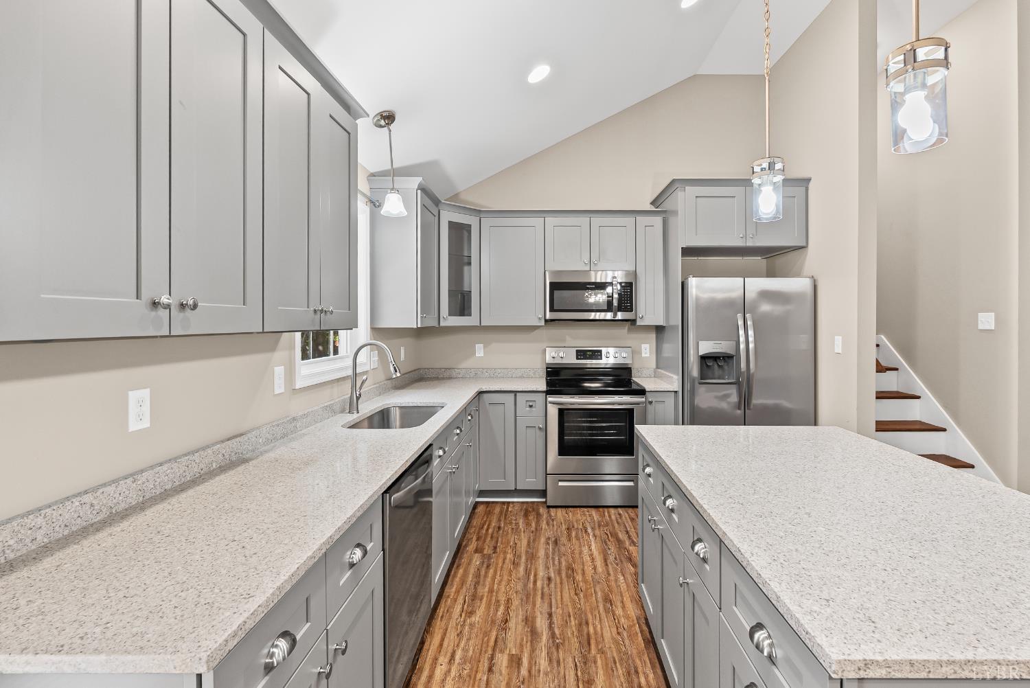 761 Chapel Grove Road Evington, VA 24550 - Photo 8 of 39 a kitchen with a sink a stove and cabinets