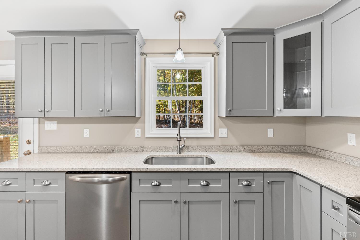 761 Chapel Grove Road Evington, VA 24550 - Photo 9 of 39 a kitchen with a sink cabinets and window