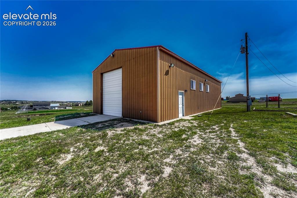 13695 Woodlake Road Elbert, CO 80106 - Photo 34 of 39 63' x 30' outbuilding.