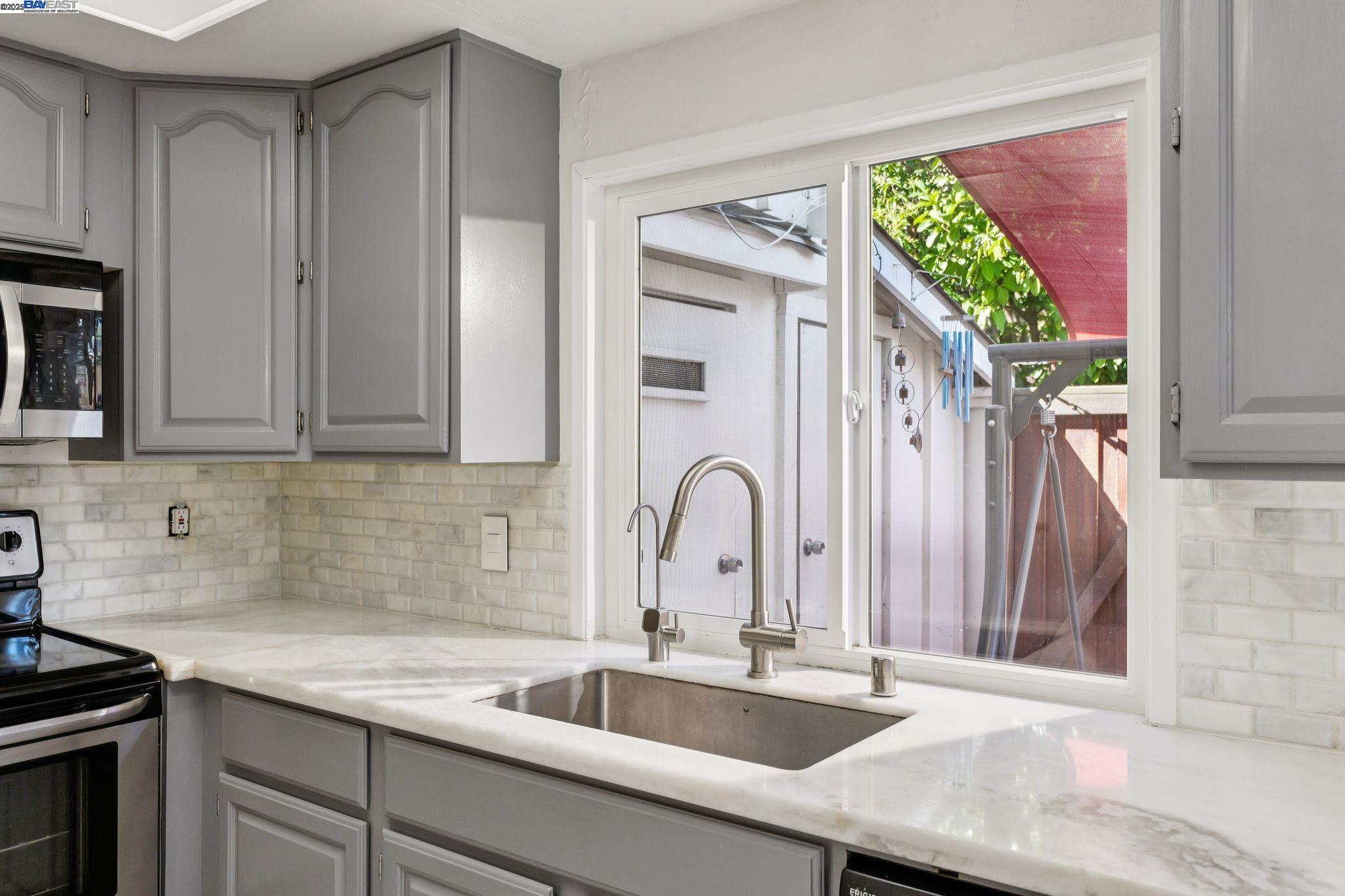 560 La Copita Court San Ramon, CA 94583 - Photo 14 of 40 a kitchen with granite countertop a sink stainless steel appliances and cabinets