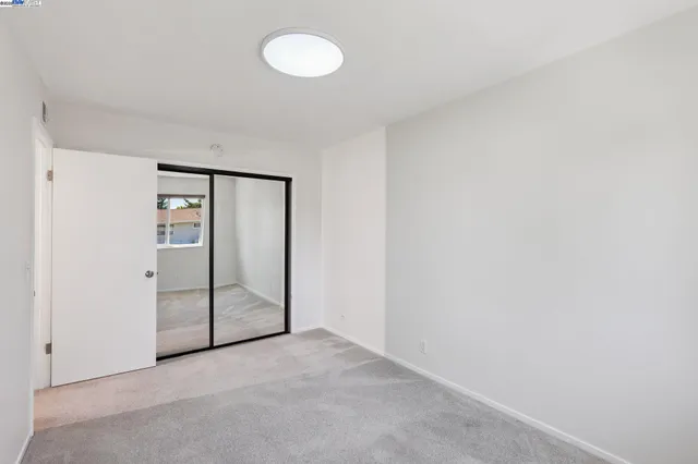 an empty room with mirror