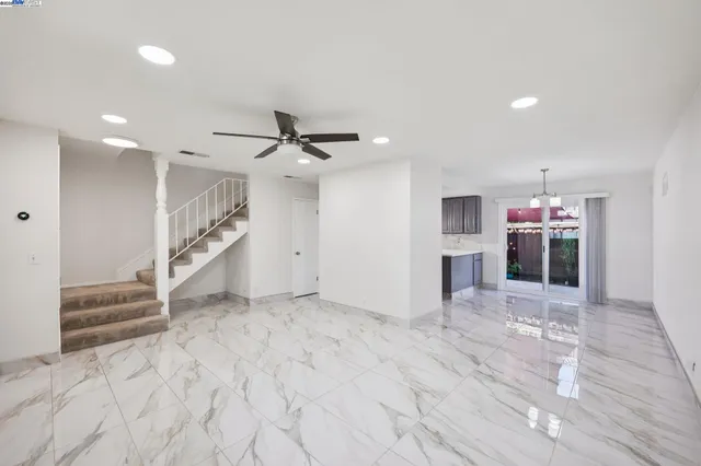a view of a livingroom with a ceiling fan