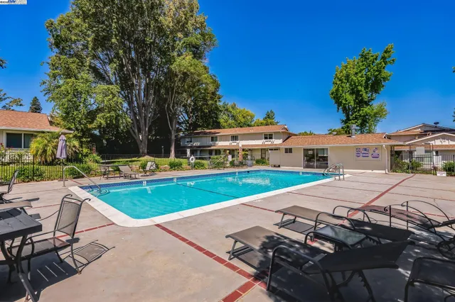 a view of a house with swimming pool