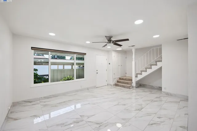 a view of an empty room with a window