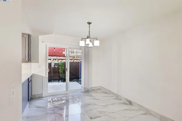 a view of a hallway with a chandelier