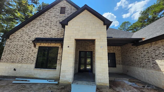 a view of front door and yard