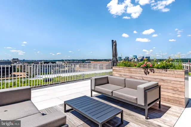 a view of a balcony with furniture