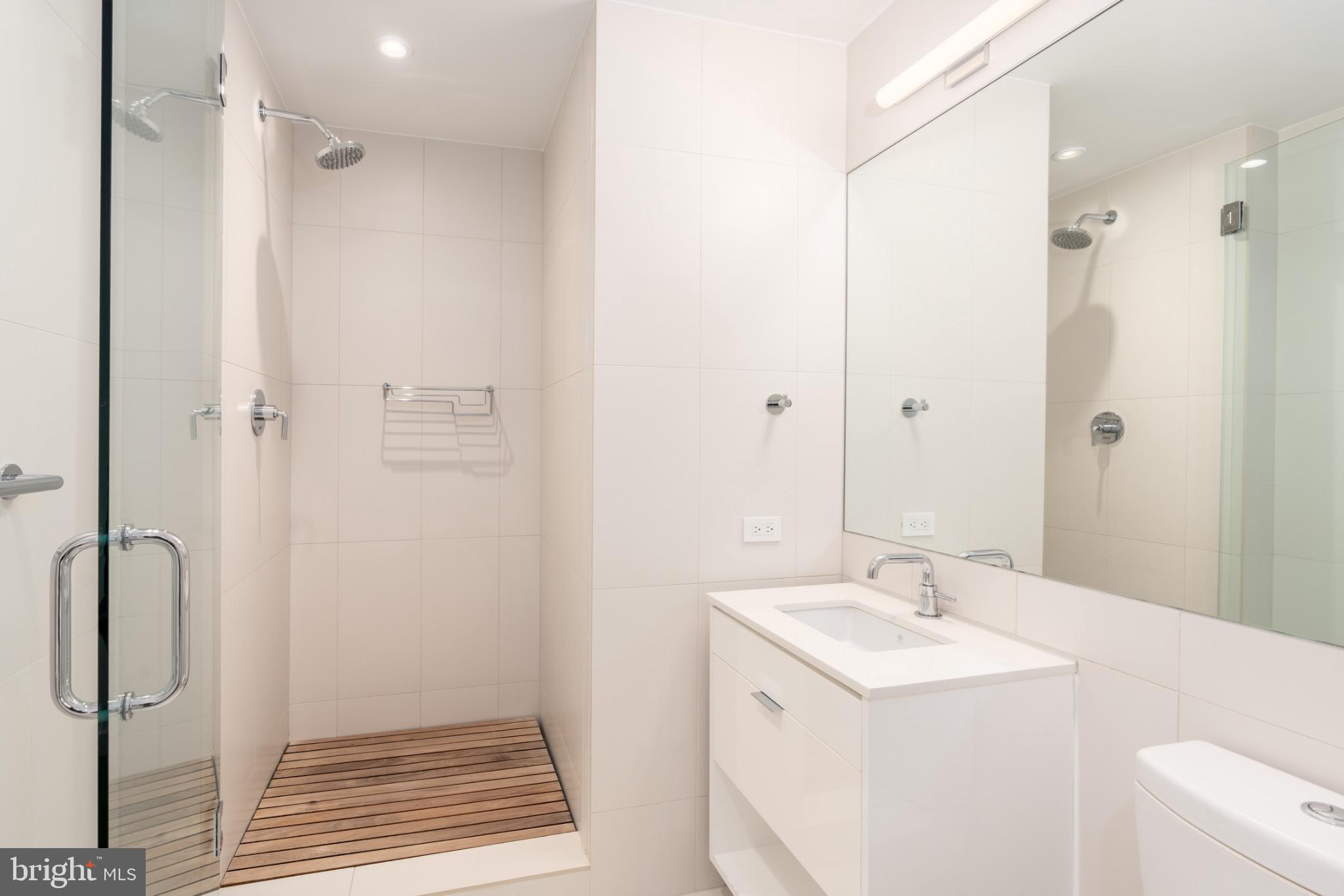 1110 23rd Street Northwest, Unit PH12 Washington, DC 20037 - Photo 7 of 19 a bathroom with a sink a toilet and shower
