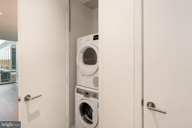 a view of a patio with two chairs and a potted plant
