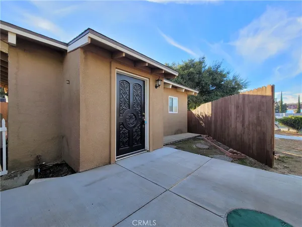 a view of backyard of house with stairs