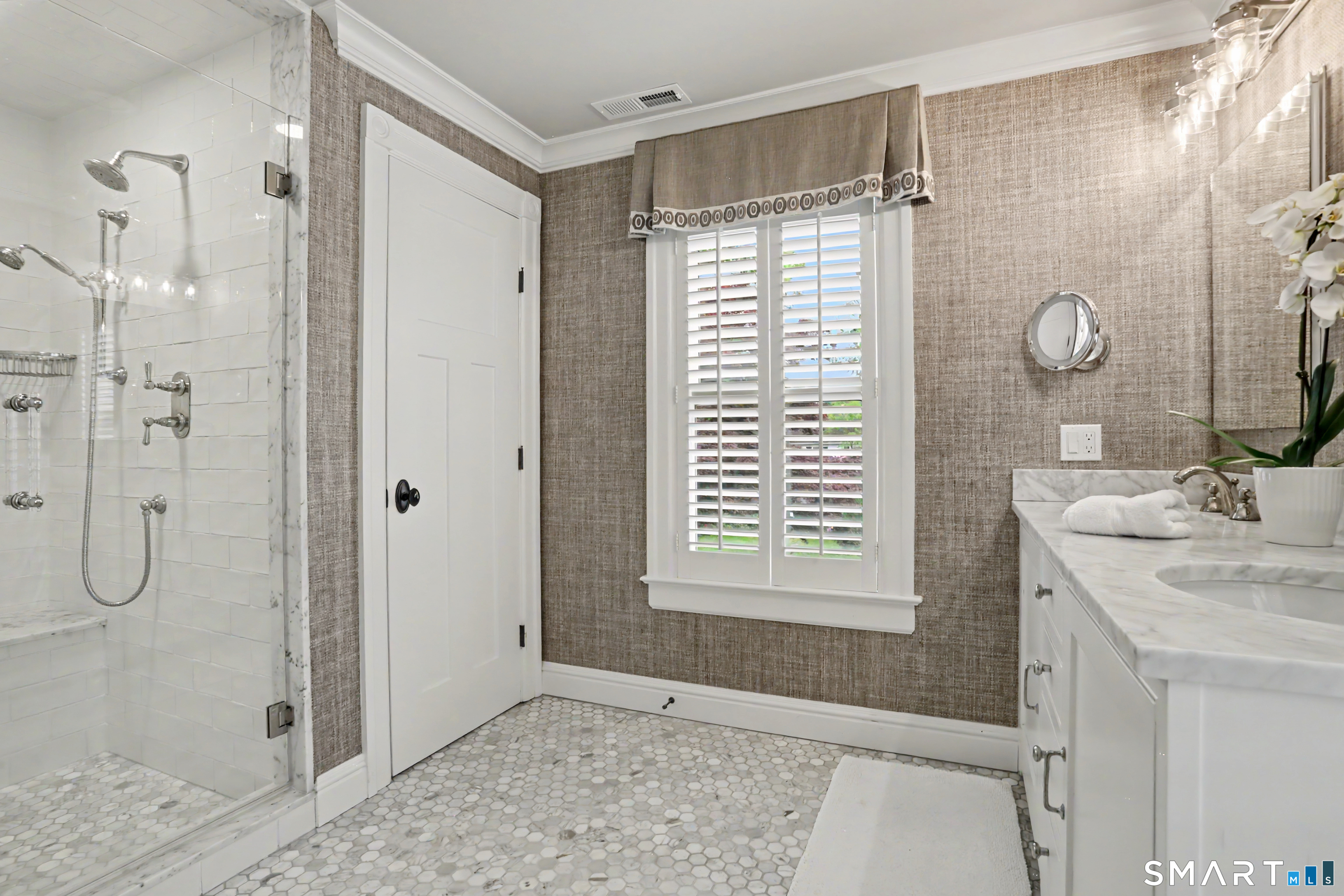36 Catoonah Street, Unit 18 Ridgefield, CT 06877 - Photo 21 of 40 a bathroom with a shower sink and mirror