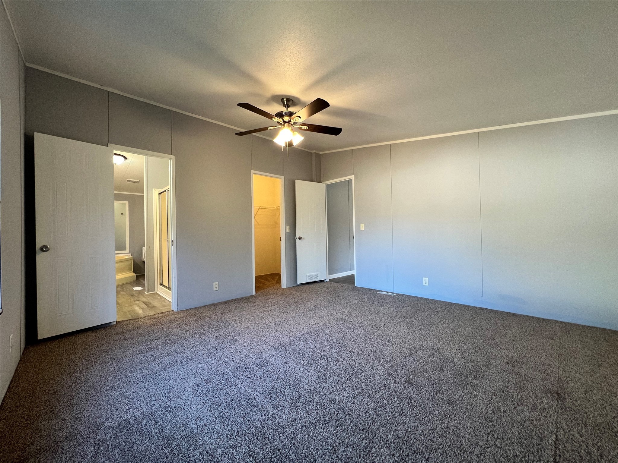 16105 Lone Star Ranch Drive Conroe, TX 77302 - Photo 15 of 24 an empty room with a ceiling fan and a window