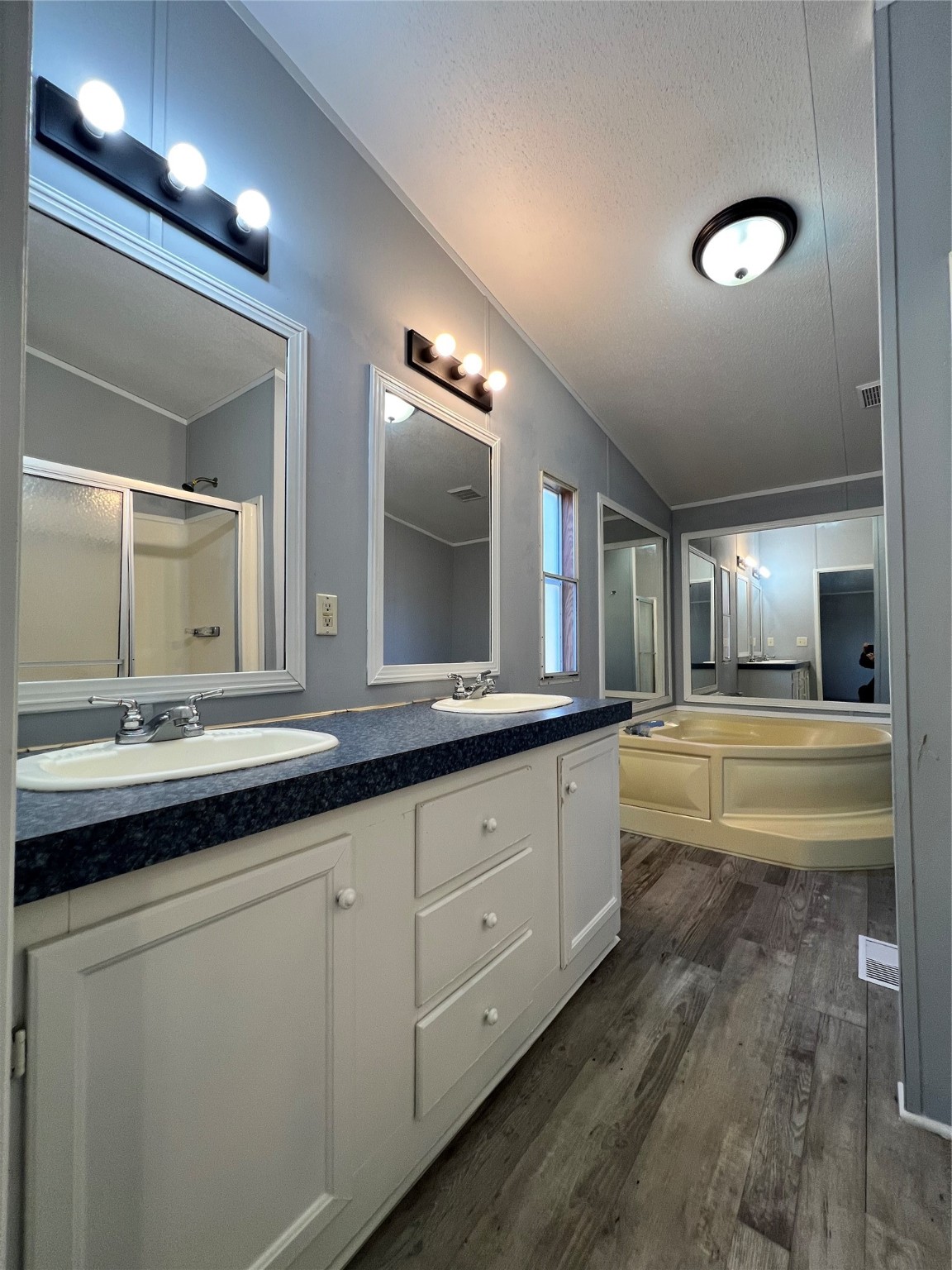 16105 Lone Star Ranch Drive Conroe, TX 77302 - Photo 16 of 24 a bathroom with sinks and a large mirror