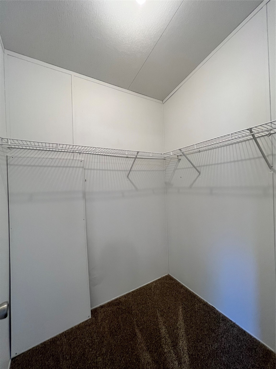 16105 Lone Star Ranch Drive Conroe, TX 77302 - Photo 19 of 24 a view of a room with racks on the wall