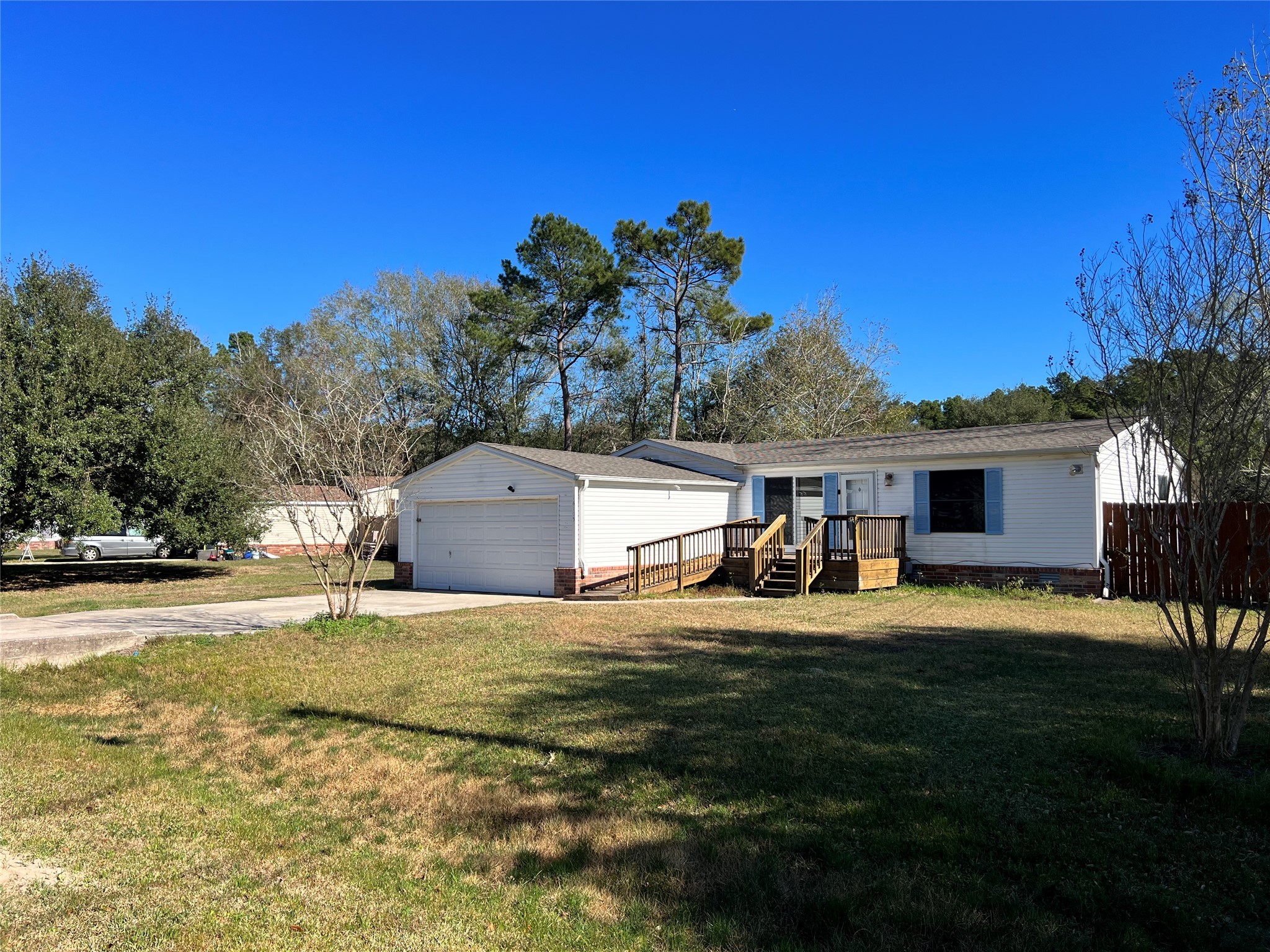 16105 Lone Star Ranch Drive Conroe, TX 77302 - Photo 2 of 24 a view of a house with backyard and sitting area