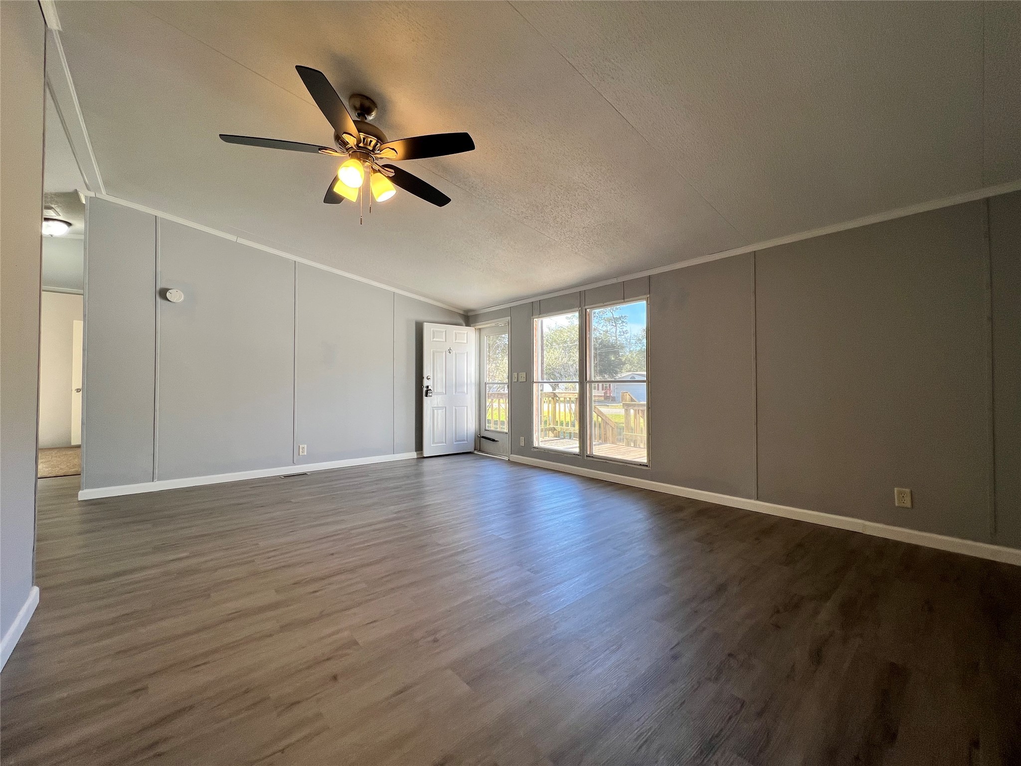 16105 Lone Star Ranch Drive Conroe, TX 77302 - Photo 6 of 24 a view of an empty room with window and wooden floor