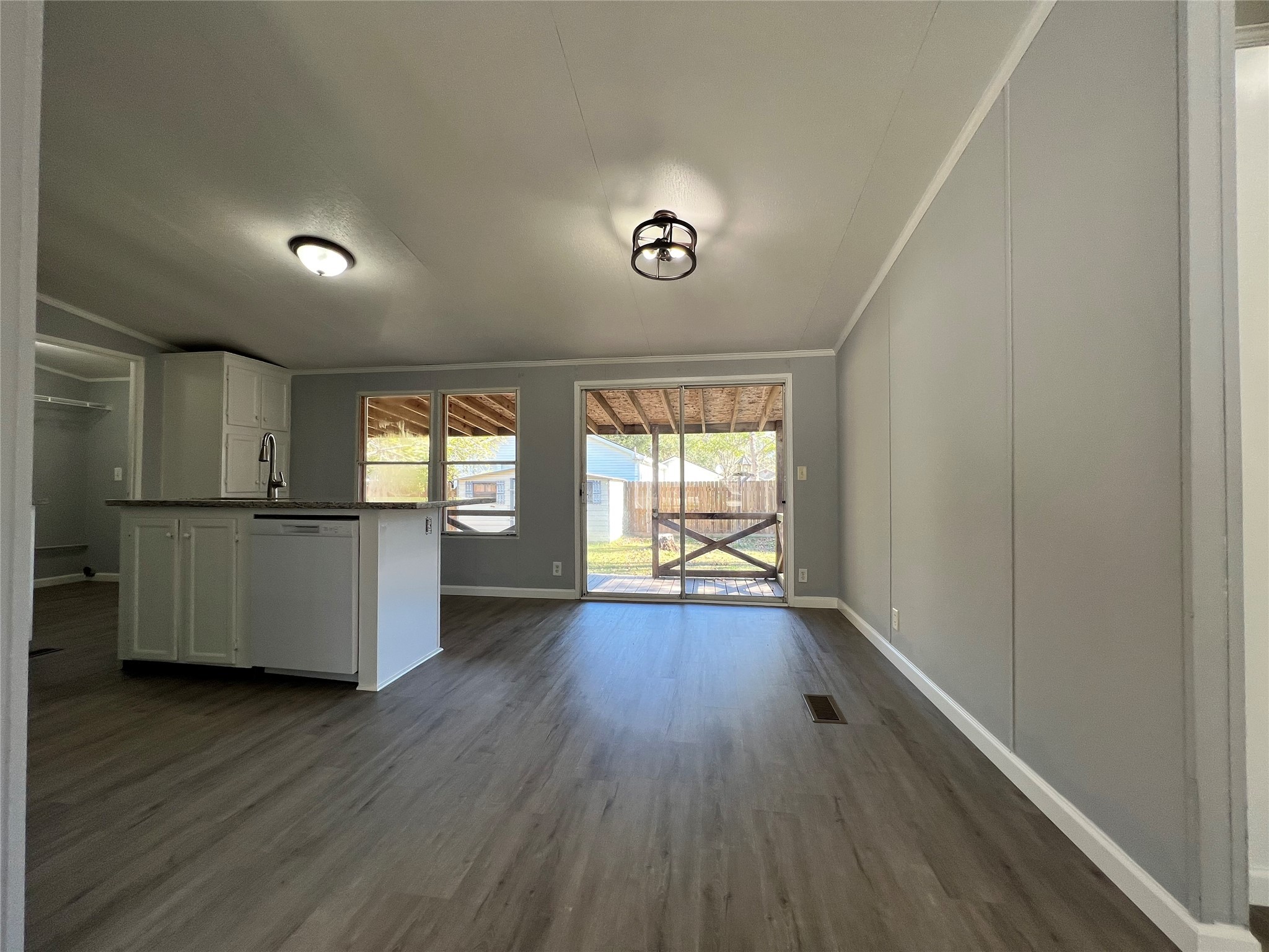 16105 Lone Star Ranch Drive Conroe, TX 77302 - Photo 8 of 24 an empty room with wooden floor and windows