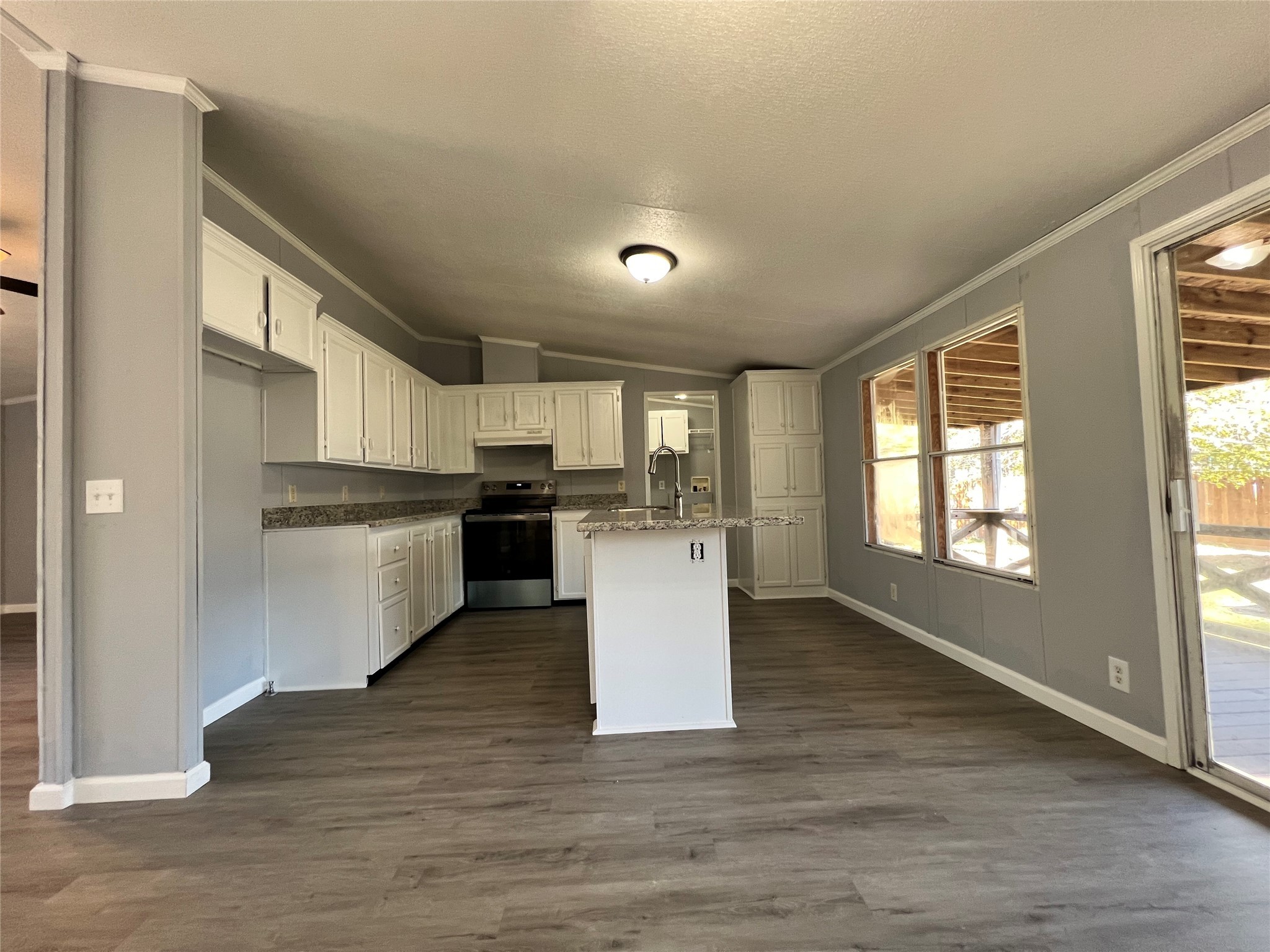 16105 Lone Star Ranch Drive Conroe, TX 77302 - Photo 9 of 24 a view of kitchen with wooden floor and electronic appliances