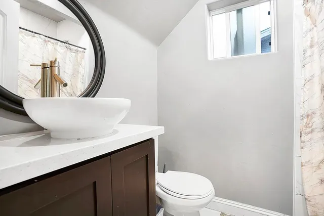 a view of a patio with a table and chairs