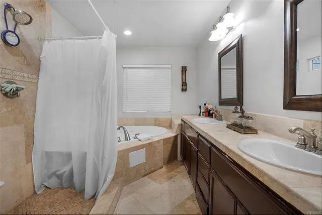a bathroom with a sink a toilet and a window