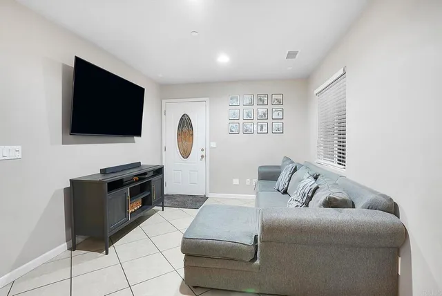 a kitchen with granite countertop stainless steel appliances a sink stove and cabinets