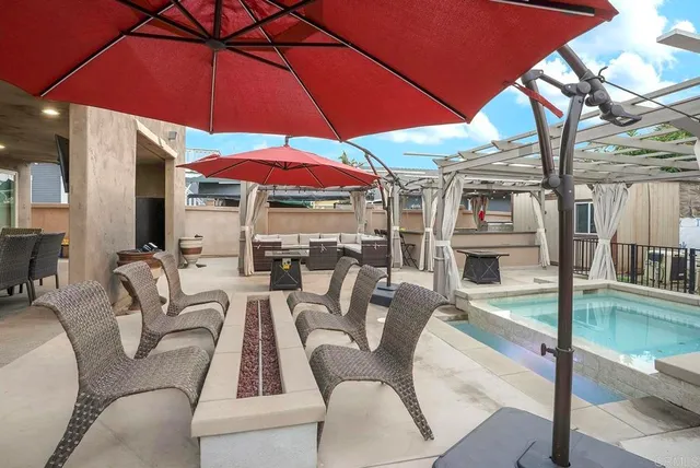 a view of a patio with a table and chairs