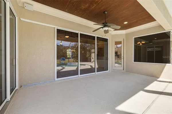 a view of an empty room with glass door