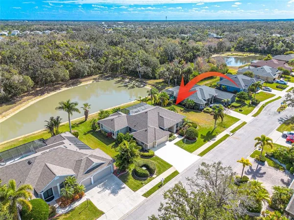 an aerial view of residential houses with outdoor space